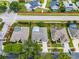 An aerial view features houses with pools in an established neighborhood with fenced yards and tree-lined streets at 3711 Half Moon Dr, Orlando, FL 32812