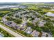 A beautiful aerial view of a neighborhood with mature trees, serene ponds, and well-maintained homes at 3711 Half Moon Dr, Orlando, FL 32812
