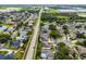 Aerial view of a peaceful neighborhood with long streets, manicured lawns, and a mix of home styles at 3711 Half Moon Dr, Orlando, FL 32812