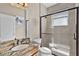 Modern bathroom with a granite countertop vanity and a large glass-enclosed shower at 3711 Half Moon Dr, Orlando, FL 32812