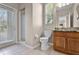 Bright bathroom with tiled floors, outdoor access and granite countertop vanity at 3711 Half Moon Dr, Orlando, FL 32812