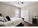 Cozy bedroom featuring hardwood floors, double closets and an updated ceiling fan at 3711 Half Moon Dr, Orlando, FL 32812