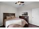 Comfortable bedroom showcasing hardwood floors, TV, ceiling fan and queen size bed at 3711 Half Moon Dr, Orlando, FL 32812