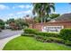 Entrance to Crescent Park community features landscaped brick signage and secure gates in a lush setting at 3711 Half Moon Dr, Orlando, FL 32812