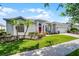Charming single-story home with well-manicured landscaping and a bright red front door at 3711 Half Moon Dr, Orlando, FL 32812