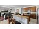 Beautiful kitchen with stainless steel appliances, wooden cabinets, granite countertops, and breakfast bar at 3711 Half Moon Dr, Orlando, FL 32812