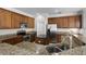 This kitchen has granite countertops, stainless appliances, an island, and wood cabinets at 3711 Half Moon Dr, Orlando, FL 32812