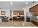 Spacious kitchen with stainless steel appliances, wood cabinets, and granite countertops at 3711 Half Moon Dr, Orlando, FL 32812
