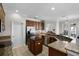 Bright kitchen with stainless steel appliances, granite countertops, and a view into the living area at 3711 Half Moon Dr, Orlando, FL 32812