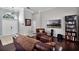 Inviting living room with hardwood floors, a high ceiling, and comfortable leather furniture at 3711 Half Moon Dr, Orlando, FL 32812