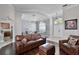 Open-concept living space with hardwood floors and a seamless flow into the dining area at 3711 Half Moon Dr, Orlando, FL 32812
