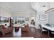 Spacious living area with hardwood floors, a view of the pool, and a dining space at 3711 Half Moon Dr, Orlando, FL 32812