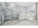 Modern bathroom boasts a glass-enclosed shower and double sink vanity at 3816 Eagle Isle Cir, Kissimmee, FL 34746