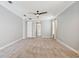 Large room features neutral carpet, doors, and bright neutral walls at 3816 Eagle Isle Cir, Kissimmee, FL 34746