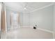 Bedroom featuring light tile floors and sheer curtains at 3816 Eagle Isle Cir, Kissimmee, FL 34746