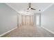 Large bedroom boasts carpet floors, ceiling fan and sun-filled windows at 3816 Eagle Isle Cir, Kissimmee, FL 34746