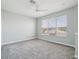 Bright bedroom with carpet, large windows and ceiling fan at 3816 Eagle Isle Cir, Kissimmee, FL 34746