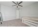 Bright bedroom with plush carpeting, a ceiling fan, and a platform bed at 3816 Eagle Isle Cir, Kissimmee, FL 34746