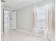 Bright bedroom features white tile flooring, natural light and neutral paint at 3816 Eagle Isle Cir, Kissimmee, FL 34746