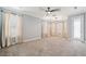 Spacious bedroom with neutral carpet, a ceiling fan, and natural lighting at 3816 Eagle Isle Cir, Kissimmee, FL 34746