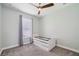 Cozy bedroom features carpet floors, ceiling fan and bright light at 3816 Eagle Isle Cir, Kissimmee, FL 34746