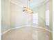Dining room featuring neutral tile floors and chandelier at 3816 Eagle Isle Cir, Kissimmee, FL 34746