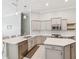 Modern kitchen with white countertops, stainless steel appliances, and gray cabinetry at 3816 Eagle Isle Cir, Kissimmee, FL 34746