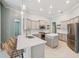 Spacious kitchen features stainless appliances, a center island, and bar seating for casual dining at 3816 Eagle Isle Cir, Kissimmee, FL 34746