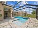 Clear swimming pool with connected spa and screened-in enclosure at 3816 Eagle Isle Cir, Kissimmee, FL 34746