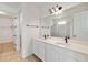 Bathroom showcasing double sinks, quartz countertops, and walk-in closet and shower at 3906 Carrick Bend Dr, Kissimmee, FL 34746