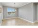 Dining area with large window, tile floors and neutral paint is a perfect place to enjoy Gathering meals at 3906 Carrick Bend Dr, Kissimmee, FL 34746