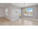 Dining area with lots of natural light from large windows, neutral paint and tile floors at 3906 Carrick Bend Dr, Kissimmee, FL 34746