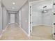 Hallway featuring recessed lighting and doorways that lead into rooms with unique lighting and neutral carpet at 3906 Carrick Bend Dr, Kissimmee, FL 34746