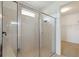 Modern shower with clear glass enclosure, white tiled walls, and chrome fixtures, providing a spa-like experience at 3906 Carrick Bend Dr, Kissimmee, FL 34746
