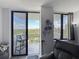 Balcony view overlooking a city skyline with a chair and skyline art on the wall at 400 E Colonial Dr # 1501, Orlando, FL 32803