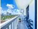Enjoy a cityscape from this condo balcony, complete with a chair and an additional storage unit at 400 E Colonial Dr # 1501, Orlando, FL 32803