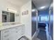 This bright bathroom features a marble vanity and convenient access to the bedroom at 400 E Colonial Dr # 1501, Orlando, FL 32803