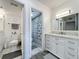 Bright bathroom with marble vanity and patterned shower curtain provides a fresh and clean space at 400 E Colonial Dr # 1501, Orlando, FL 32803