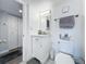 Bathroom featuring a vanity with marble countertop, a mirror, and a commode at 400 E Colonial Dr # 1501, Orlando, FL 32803