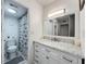 Bright bathroom with marble vanity and patterned shower curtain provides a fresh and clean space at 400 E Colonial Dr # 1501, Orlando, FL 32803