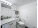 Bathroom featuring a vanity with marble countertop and a mirror with modern lighting at 400 E Colonial Dr # 1501, Orlando, FL 32803