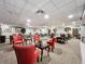 Bright community common room featuring comfortable seating areas and tables for games and socializing at 400 E Colonial Dr # 1501, Orlando, FL 32803