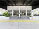 Exterior front entrance into the highrise condo building with double doors at 400 E Colonial Dr # 1501, Orlando, FL 32803