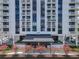 Beautiful entrance to the 400 Park Lake Towers building with flowers and awning at 400 E Colonial Dr # 1501, Orlando, FL 32803