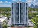 Tall white highrise condominium building with balconies and city views on a sunny day at 400 E Colonial Dr # 1501, Orlando, FL 32803