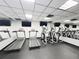 Modern gym with treadmills, ellipticals, and TVs for a convenient and engaging cardio workout at 400 E Colonial Dr # 1501, Orlando, FL 32803