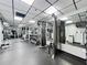 Fully-equipped gym with modern weight machines and mirrors for a complete workout experience at 400 E Colonial Dr # 1501, Orlando, FL 32803