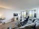 Spacious living room with large windows and views, comfortable seating, and modern decor at 400 E Colonial Dr # 1501, Orlando, FL 32803