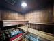 Inviting sauna with wooden benches and wood paneled walls and heater with rocks at 400 E Colonial Dr # 1501, Orlando, FL 32803