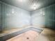 Enjoy this relaxing steam room featuring tiled walls and built in tile benches at 400 E Colonial Dr # 1501, Orlando, FL 32803